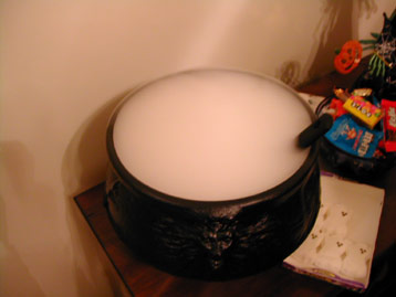 cauldron full of liquor and dry ice